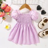 Robe smockée imprimée à col carré